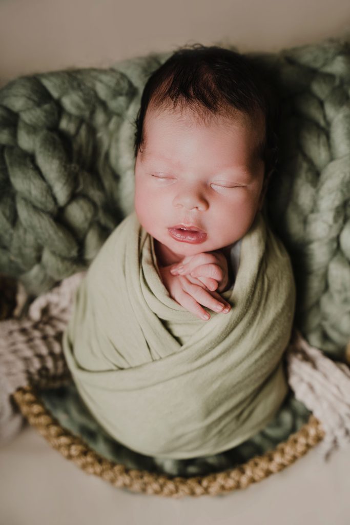 Newborn photography, Jacksonville FL, Carolennys Studios, green wrapped newborn baby